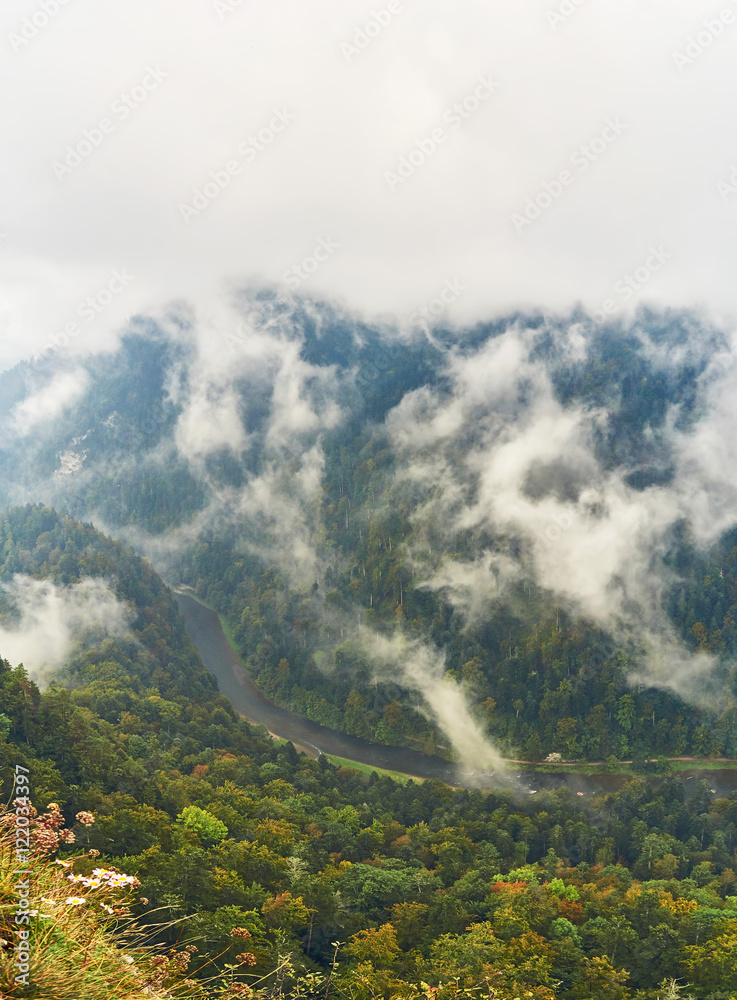 Beautiful panoramic view of the Dunajec river and Pieniny National Park, Poland, in rainy foggy september day Beautiful panoramic view of the Dunajec river and Pieniny National Park, Poland, in rainy foggy september day