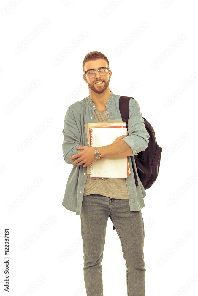 A male student with a school bag holding books isolated on white background A male student with a school bag holding books isolated on white background