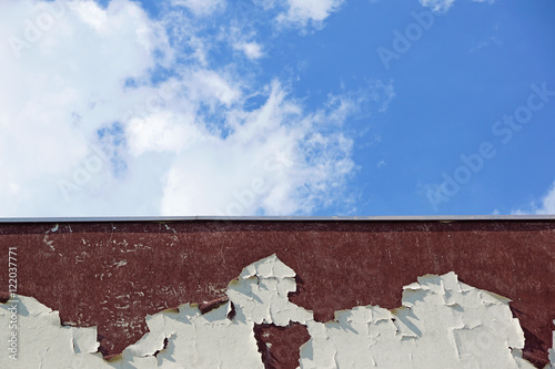 damaged wall detail and blue sky