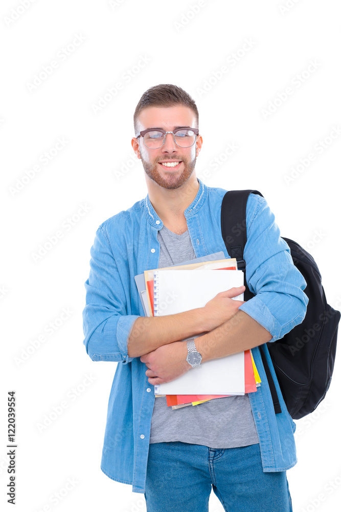 A male student with a school bag holding books isolated on white background A male student with a school bag holding books isolated on white background