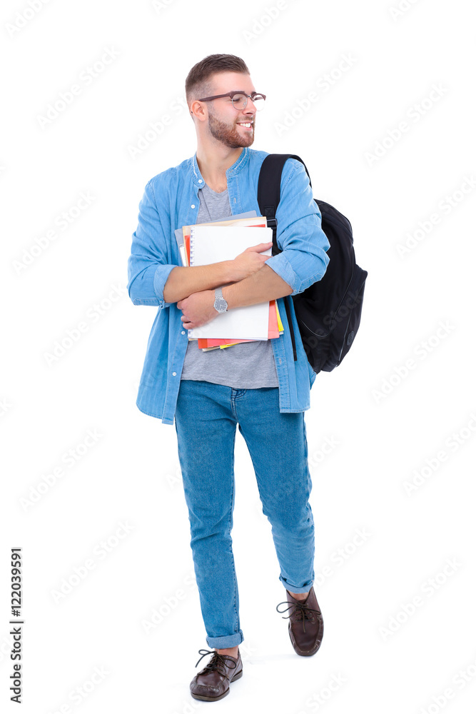 A male student with a school bag holding books isolated on white background A male student with a school bag holding books isolated on white background