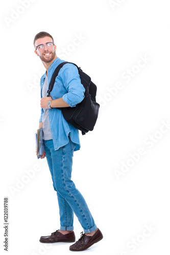 A male student with a school bag holding books isolated on white background
