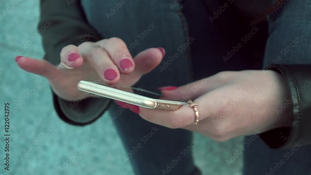 Woman using app on smartphone smiling and texting on mobile phone. Beautiful multicultural young casual female professional on mobile phone. Mixed race Caucasian Caucasian model. Woman using app on smartphone smiling and texting on mobile phone. Beautiful multicultural young casual female professional on mobile phone. Mixed race Caucasian Caucasian model.