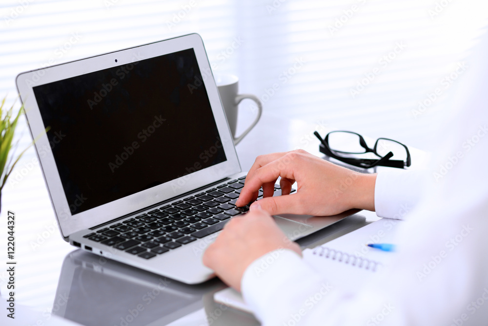 Close-up of Business woman is typing on laptop computer Close-up of Business woman is typing on laptop computer