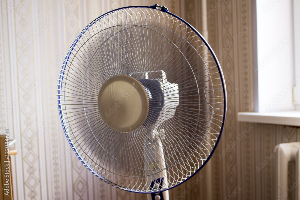 electric fan in the room. Operated ventilator - obrazy, fototapety, plakaty 