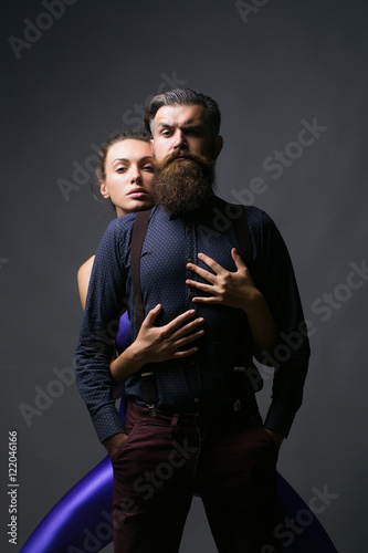 Pretty girl embraces handsome man