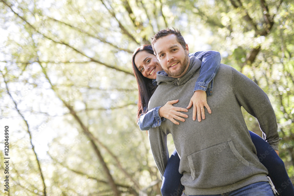Nice couple having good time in the forest Nice couple having good time in the forest