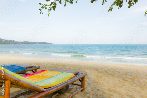 Sun-beds on a bounty beach with a blue sea