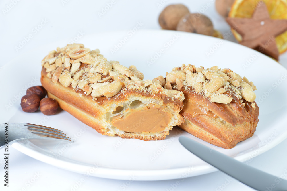 delicious eclairs on background cup of coffee delicious eclairs on background cup of coffee