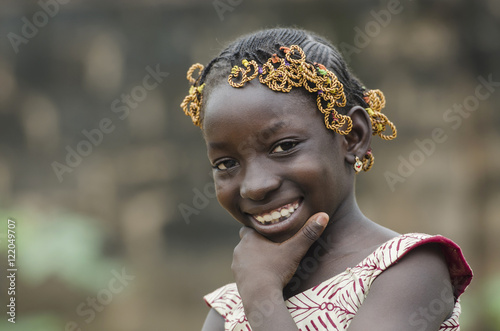 Gorgeous African Girl Thinking about her Future whilst laughing and smiling happily