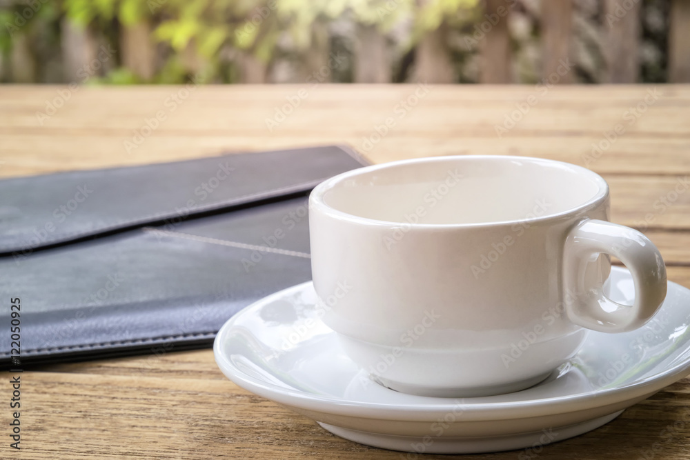 hite coffee cup and leather document envelope. hite coffee cup and leather document envelope.
