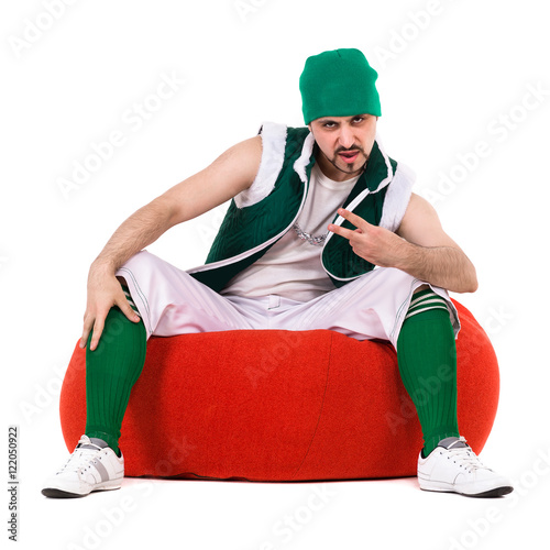 Young performer dressed like a funny gnome posing isolated on the white photo