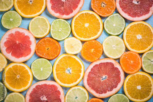 Exotic citrus slices overhead background