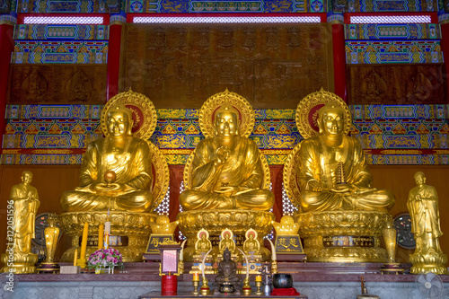 NONTHABURI, THAILAND - AUG 21, 2016 : Buddha statue of Three Lord Buddha of Wat Borom Racha Kanchana Phisake on August 21, 2016 in Nonthaburi, Thailand.