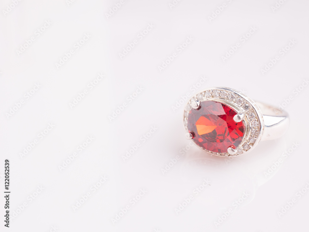 Jewel gemstone ring on white shine table Jewel gemstone ring on white shine table