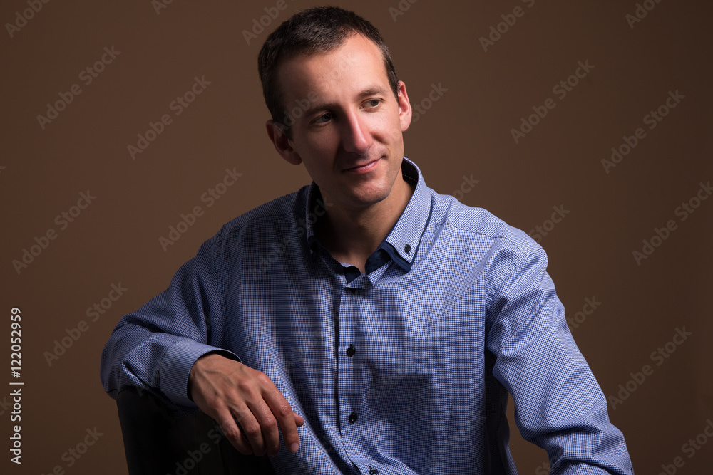 portrait of handsome middle aged man over brown portrait of handsome middle aged man over brown