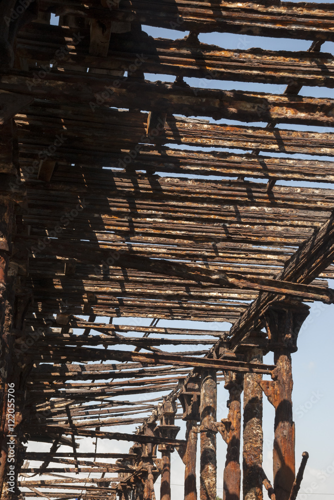 Old rusty pier in Guatemala shot in a cloudy morning. Champerico