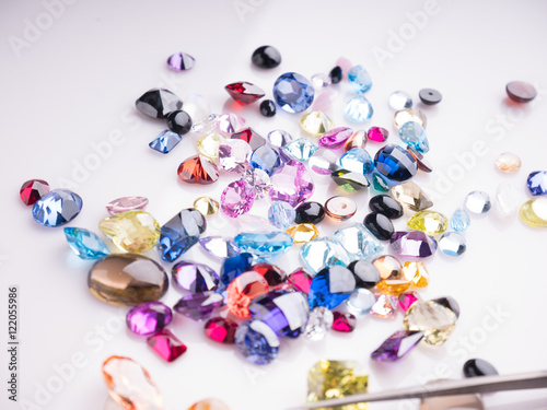 Jewel or gems on White shine color, Collection of many different natural gemstones amethyst, lapis lazuli, rose quartz, citrine, ruby, amazonite, moonstone, labradorite, chalcedony, blue topaz