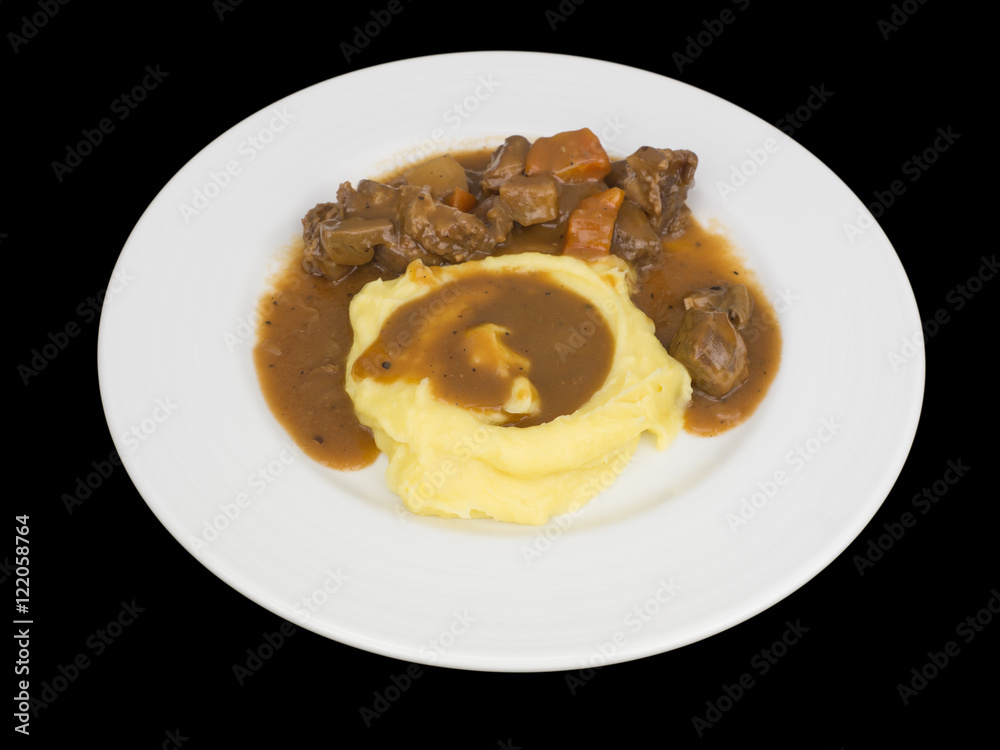 Beef stew with mashed potatoes isolated on the black background with clipping path Beef stew with mashed potatoes isolated on the black background with clipping path