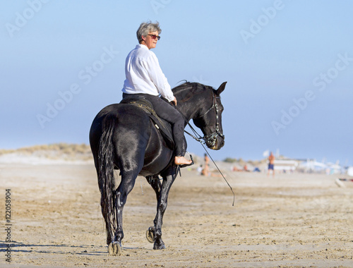 Obraz na plátně horsewoman on the beach