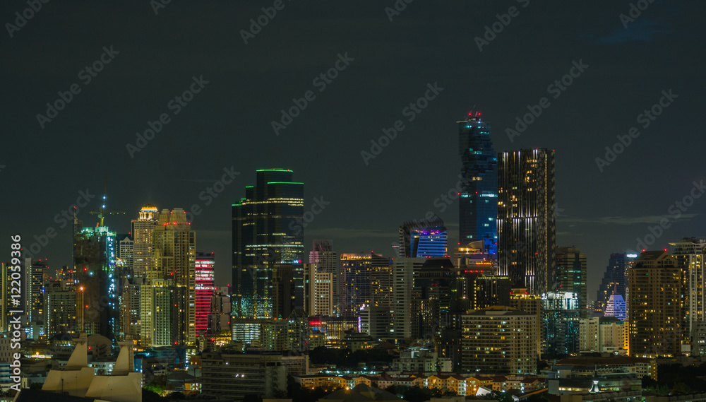 Buildings in downtown city at night.