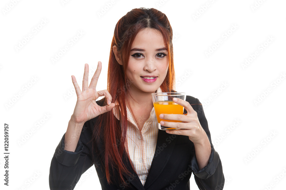 Young Asian woman drink orange juice show OK sign. Young Asian woman drink orange juice show OK sign.