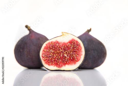 Fresh figs isolated on white with reflection