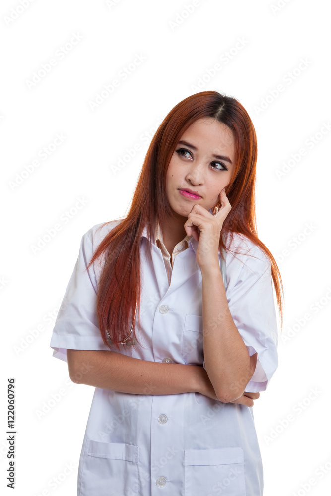 Asian young female doctor thinking looking up. Asian young female doctor thinking looking up.