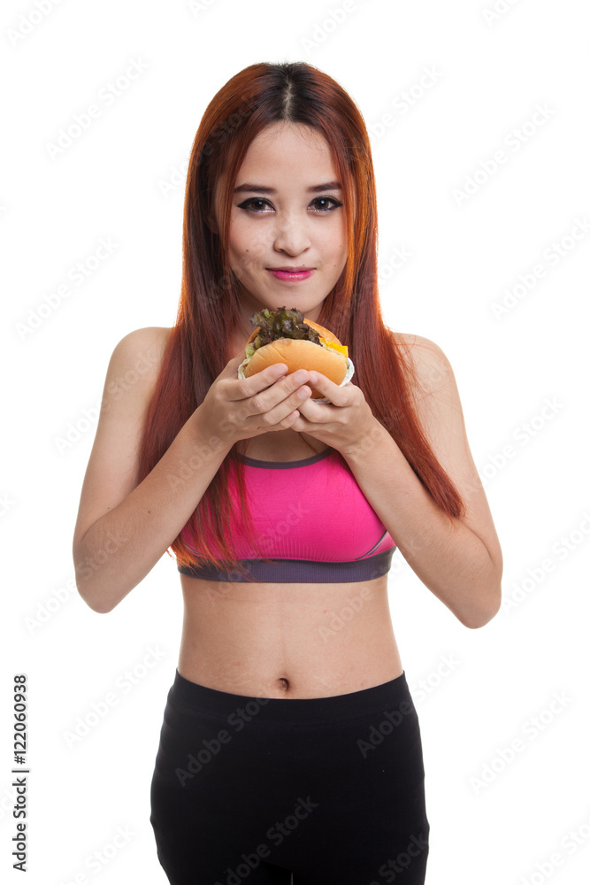 Beautiful Asian healthy girl enjoy eating hamburger. Beautiful Asian healthy girl enjoy eating hamburger.