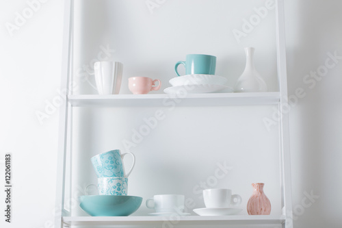 Clean dishes on wooden shelf
