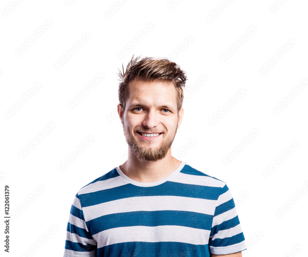 Hipster man in striped blue t-shirt, studio shot, isolated Hipster man in striped blue t-shirt, studio shot, isolated