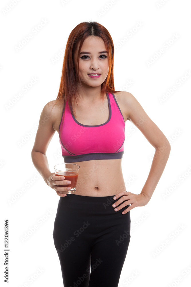 Beautiful healthy Asian girl with tomato juice.