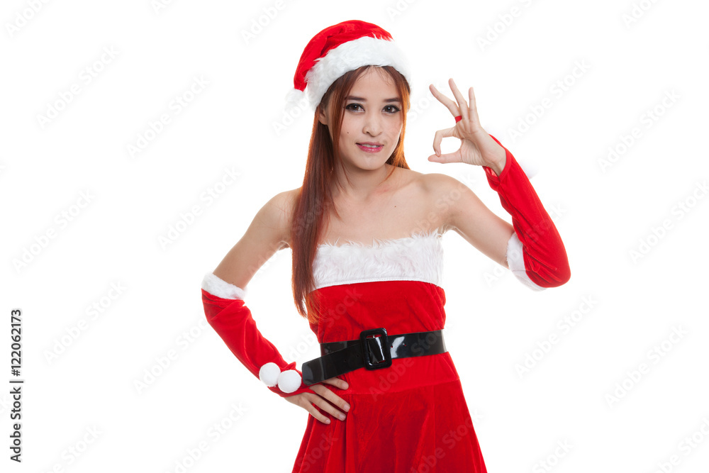 Asian Christmas Santa Claus girl show Ok sign. Asian Christmas Santa Claus girl show Ok sign.