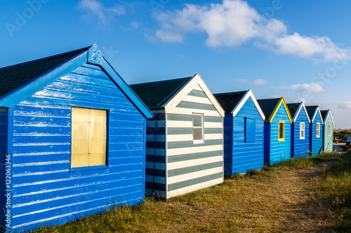 Row of blue beach hut at Southwold beach, UK