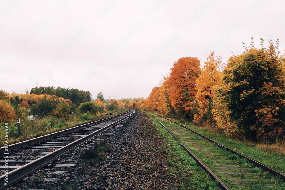 Obraz premium Railway landscape in autumn colors