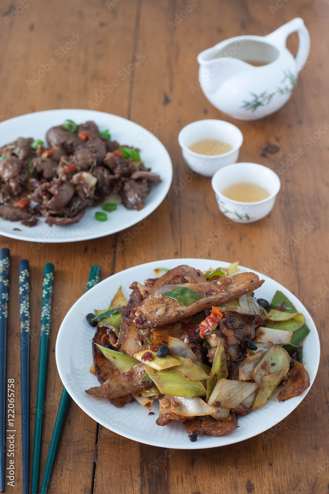Twice cooked pork - traditional Chinese dish from Sichuan region . 
Spicy cumin lamb - traditional Uyghur dish  from Xinjiang region in China. 