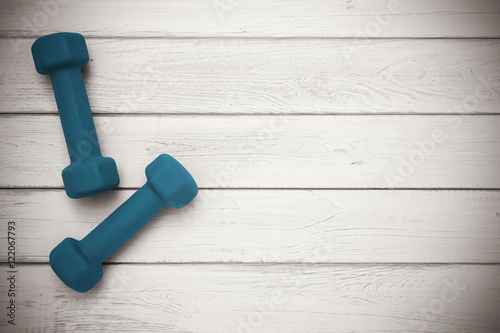 Pair of dumbbells on wooden background