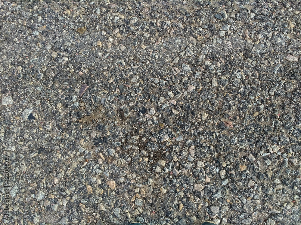 The texture of gravel, asphalt gray. The texture of gravel, asphalt gray.