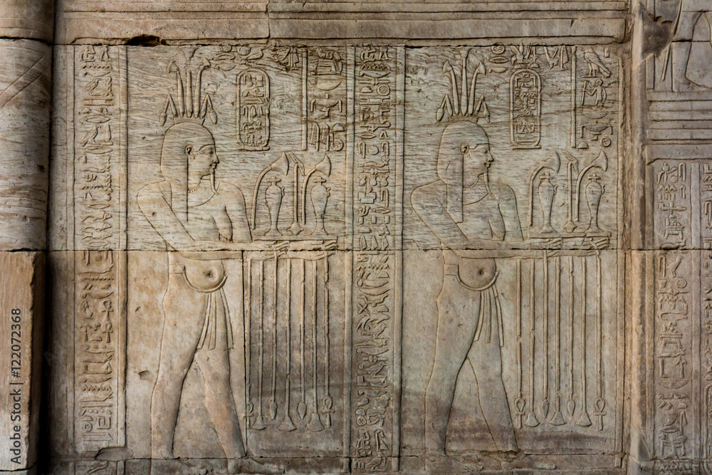 Hieroglyphic carvings on the exterior walls of  egyptian temple