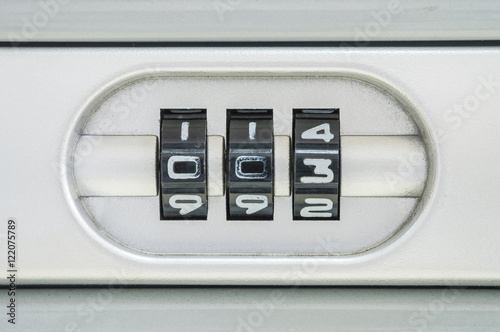 Obraz na plátně Closeup code number for lock the old suitcase background with 003 password