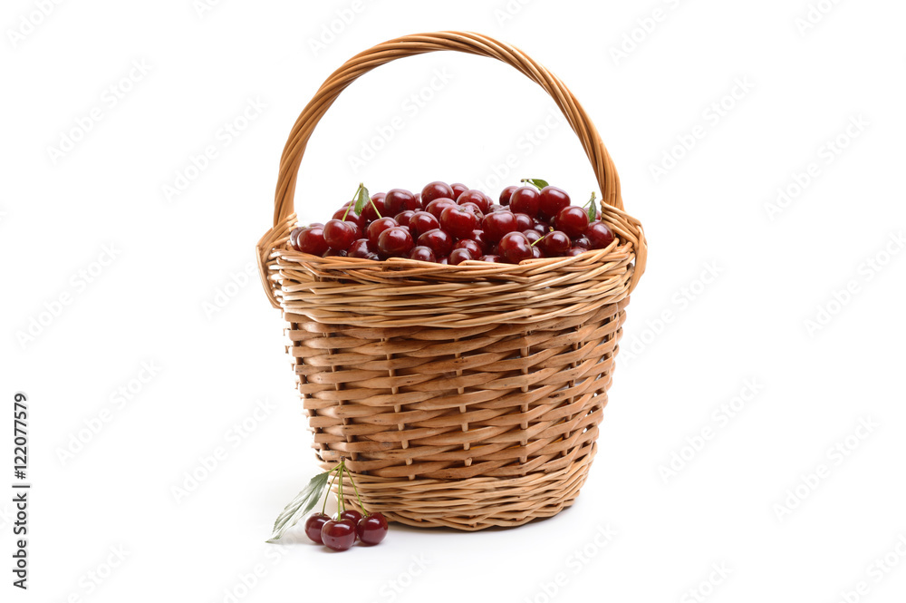 Basket full of fresh red cherry on a white background Basket full of fresh red cherry on a white background
