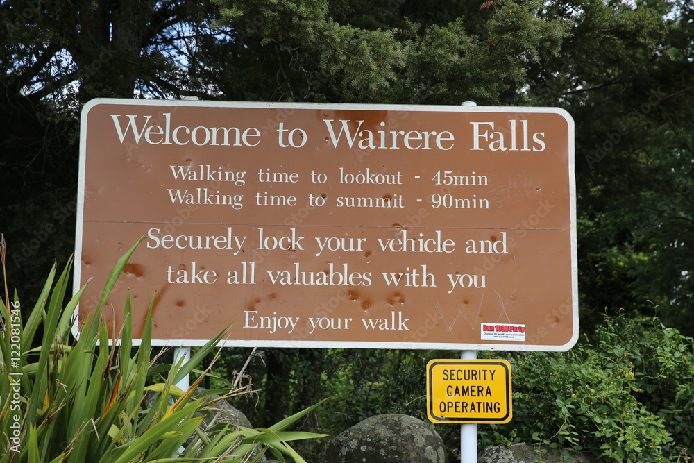 Brown board sign representing : Welcome to Wairere Falls, New Zealand