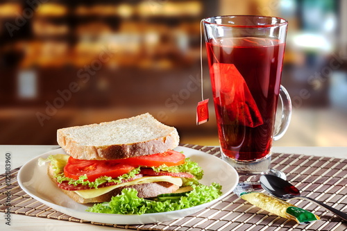Sandwich and red fruit tea