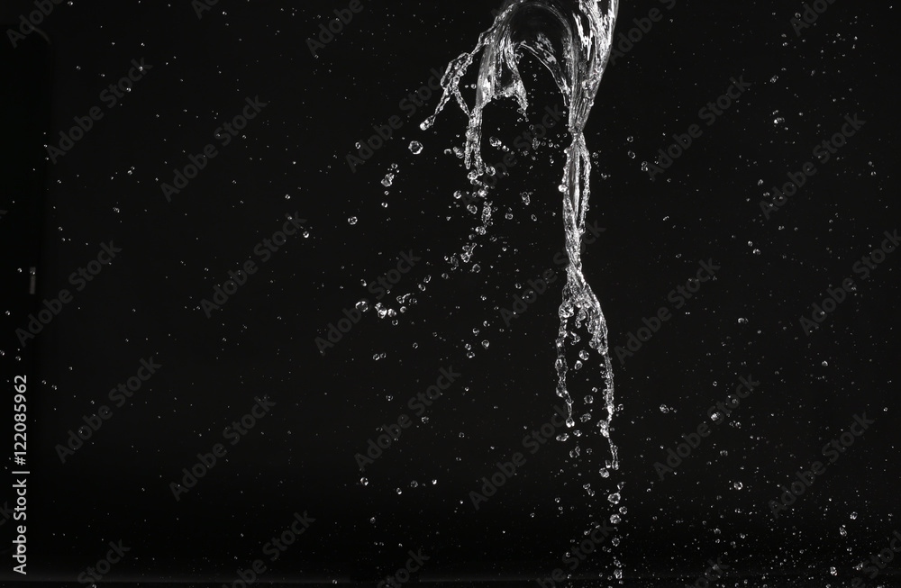 Splash of water with air bubbles. Close up. Black background