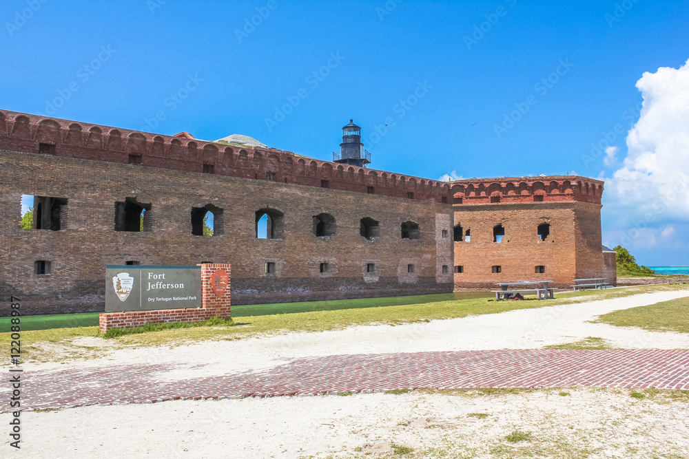 The entrance of Fort Jefferson, a historical military fortress, dominated by Garden Key Lighthouse, on Dry Tortugas National Park, Florida, United States.