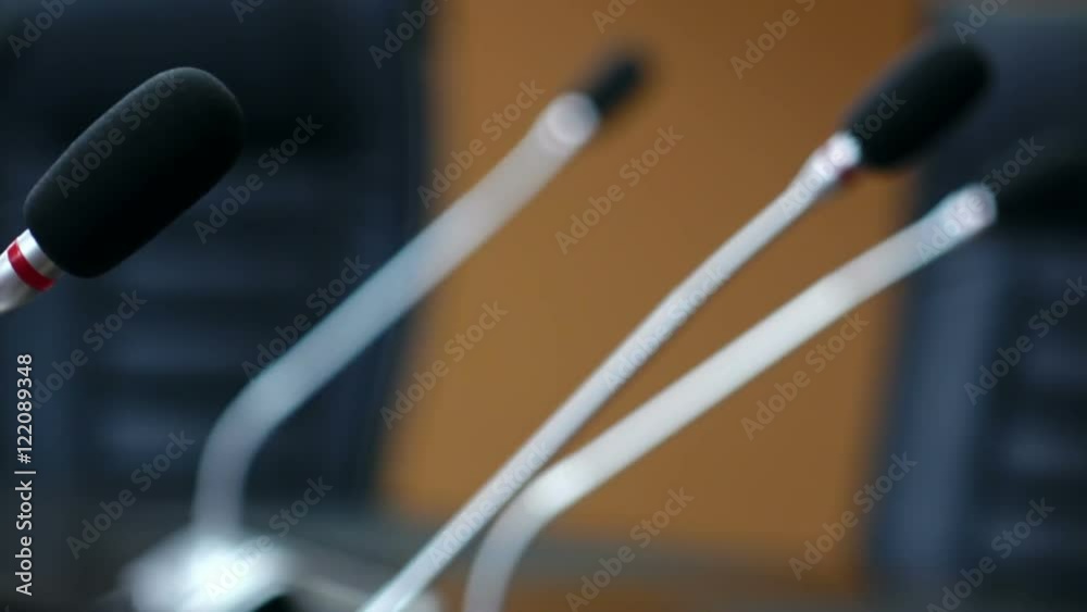 Dolly shot of microphones in modern conference room. Shallow DOF Dolly shot of microphones in modern conference room. Shallow DOF