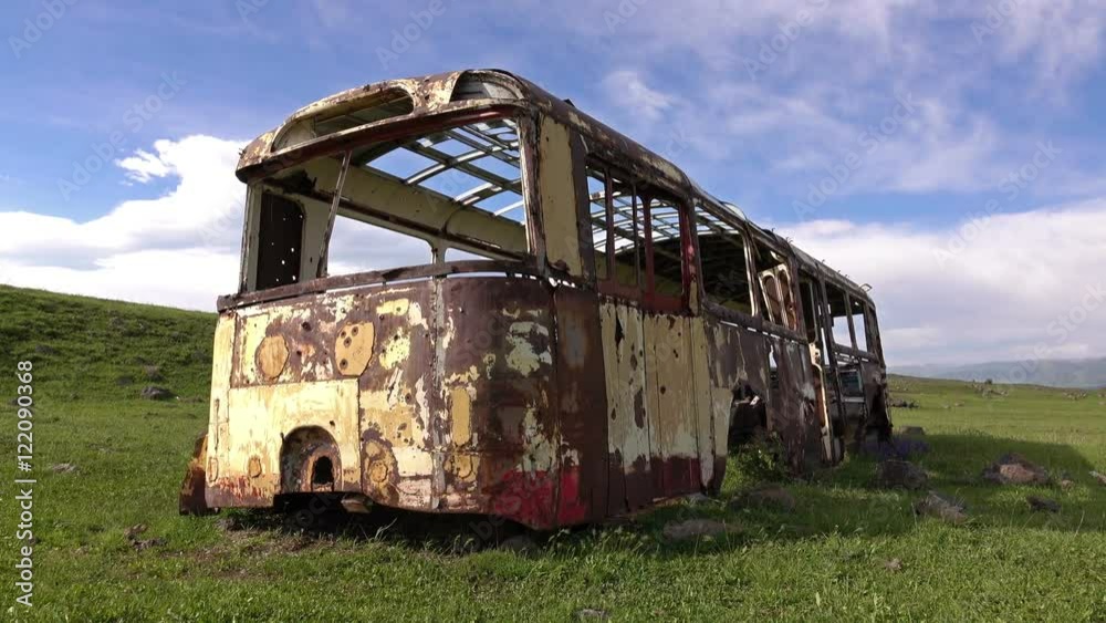 Dolly shot of the rusted auto bus
