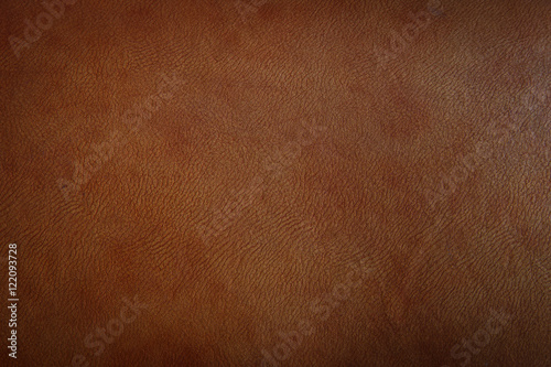 Dark brown leather texture closeup can be used as background.