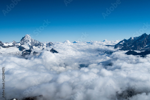 Photography Mountain peaks above the clouds