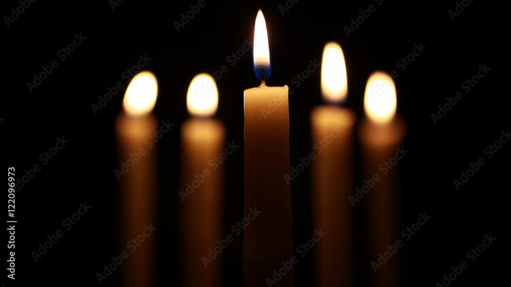 Five candles with focus on the center and a shallow depth of field. Five candles with focus on the center and a shallow depth of field.